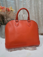 Load image into Gallery viewer, LV ORANGE LEATHER EPI ALMA 12"w 9.5ht
